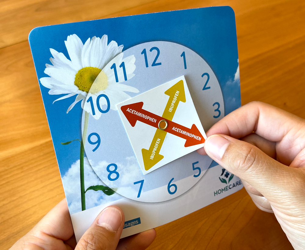 Someone holding a Comfort Control Clock 